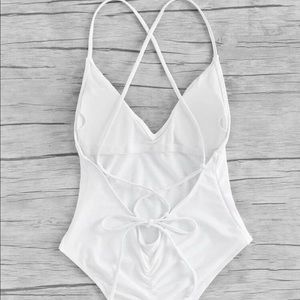 White one piece swimsuit. Brand new & never used